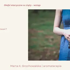 Kobieta w ciąży trzyma USG, tworząc serce dłońmi. Temat: olejki eteryczne w ciąży – bezpieczeństwo, stosowanie i źródła wiedzy.