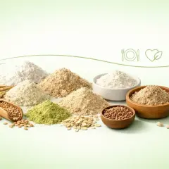 Różne rodzaje mąk i ziaren, w tym mąka pszenna, symbolizujące zdrową dietę.