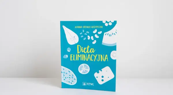 Książka "Dieta eliminacyjna" Joanny Dronki-Skrzypczak z ilustracjami owoców, warzyw i sera.