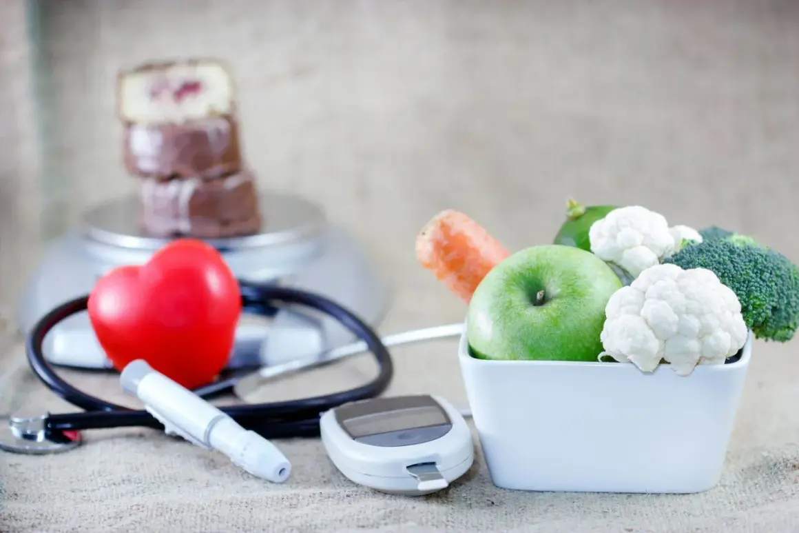 Zdrowe jedzenie, jak jabłko i warzywa, wspiera dietę mitochondrialną. Obok serce, stetoskop i glukometr symbolizują troskę o zdrowie.
